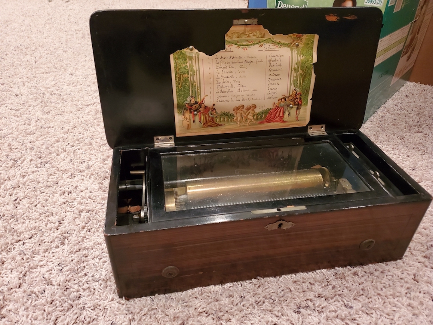 E.L. Cuendet music box Antiques Board