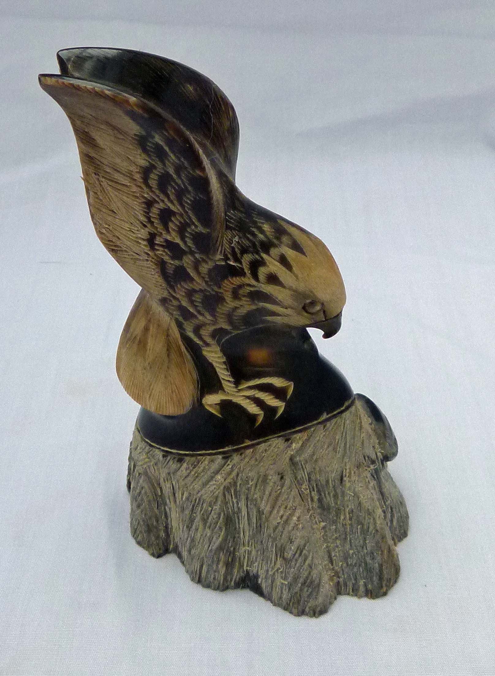 35. Superb quality small carved horn eagle on rock.jpg