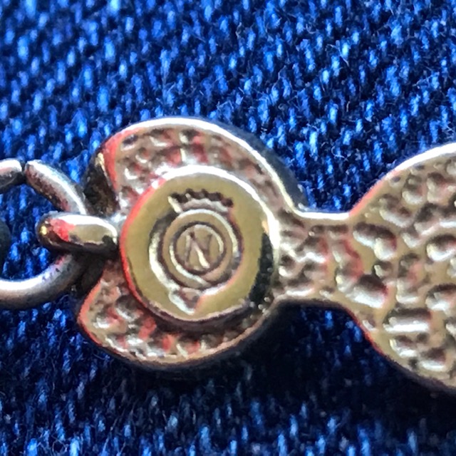 Costume necklace stamped N and Crown Antiques Board