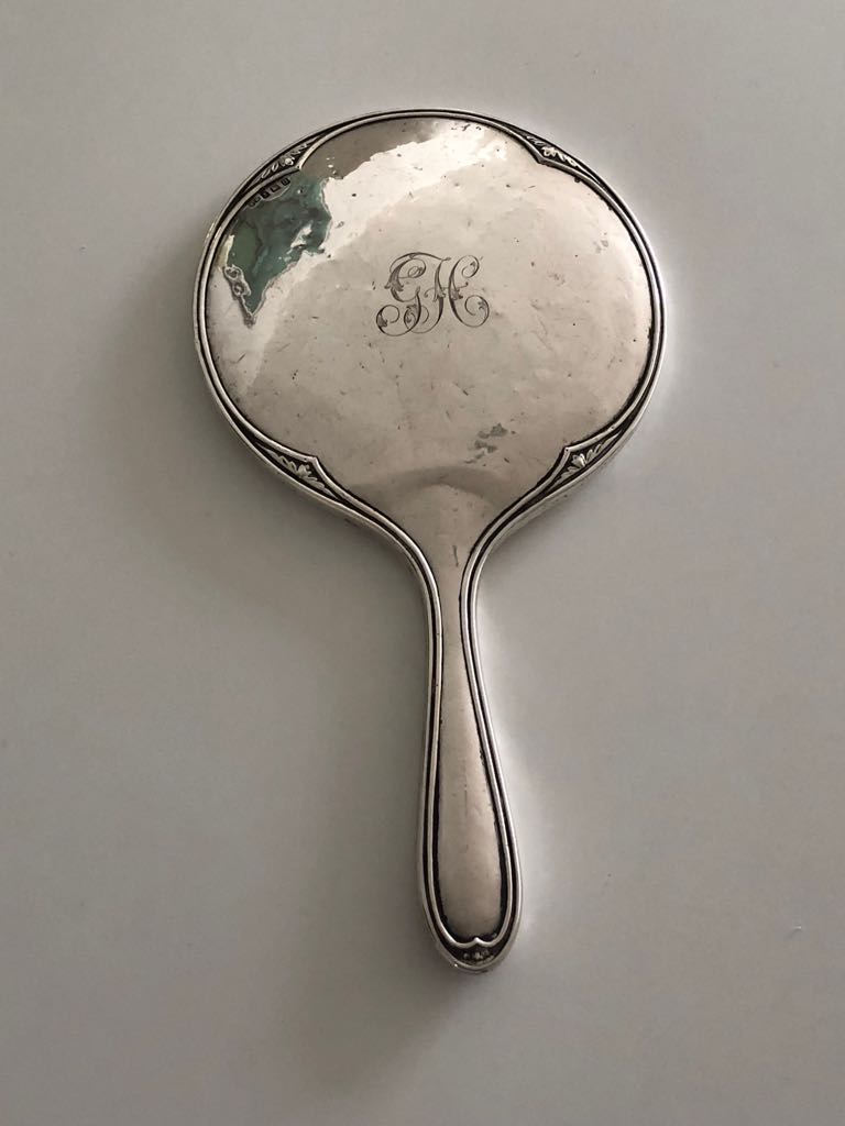 How old is this antique silver hand mirror? Can't read the hallmarks