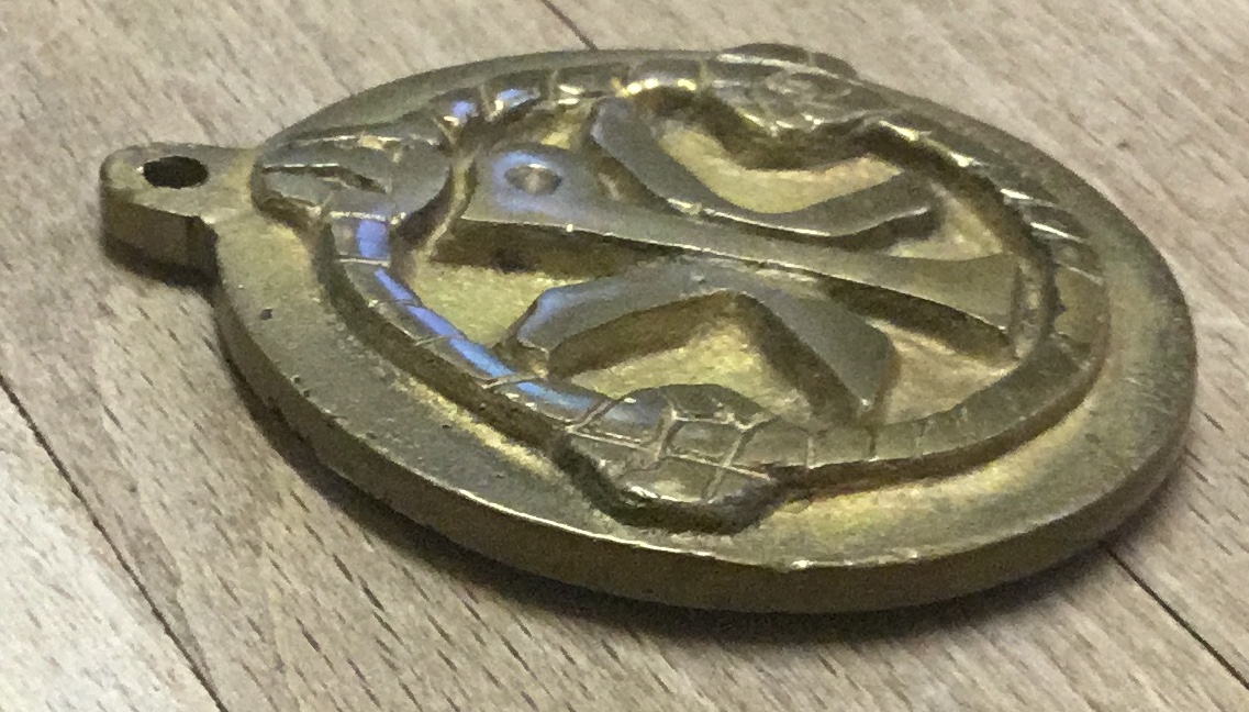 Heavy brass or bronze medallion. Antiques Board
