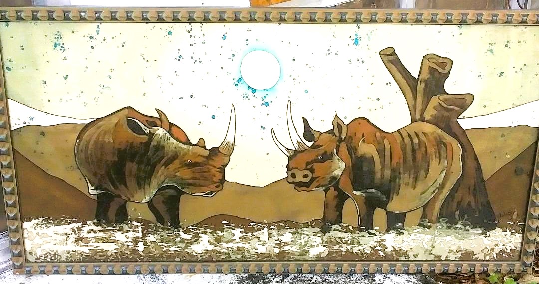 African(?) painting of rhinos on a fabric stretched over board/wood