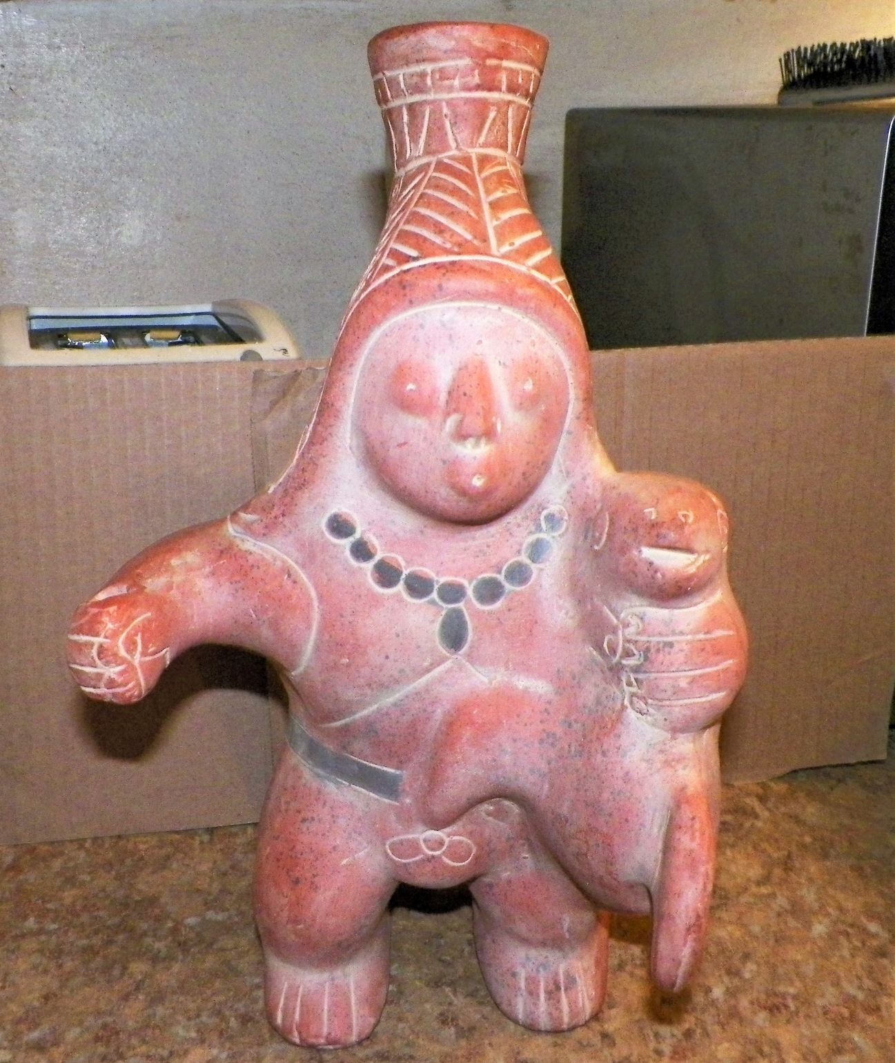 ART SCULPTURE MEXICAN FIGURE HOLDING SEAL BODY 1AA.JPG