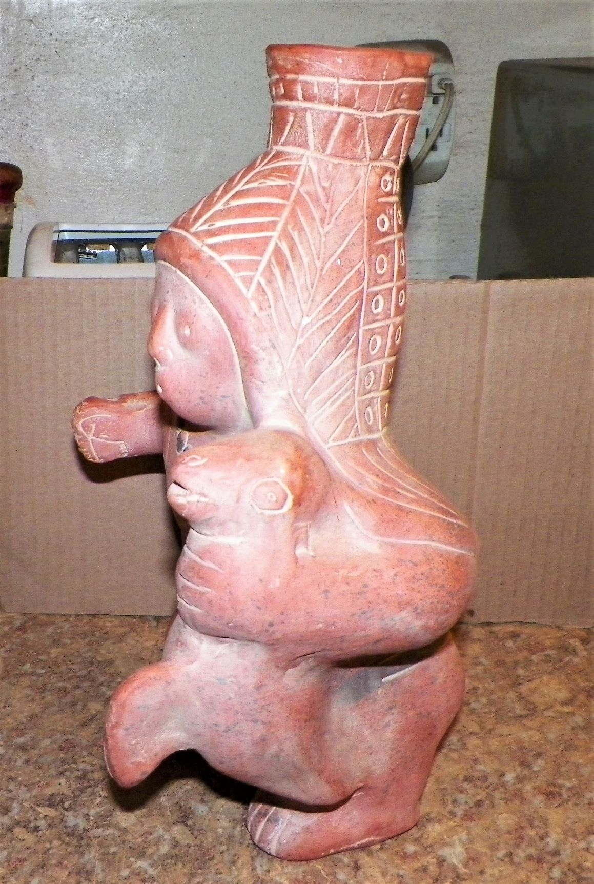 ART SCULPTURE MEXICAN FIGURE HOLDING SEAL BODY 2AA.JPG