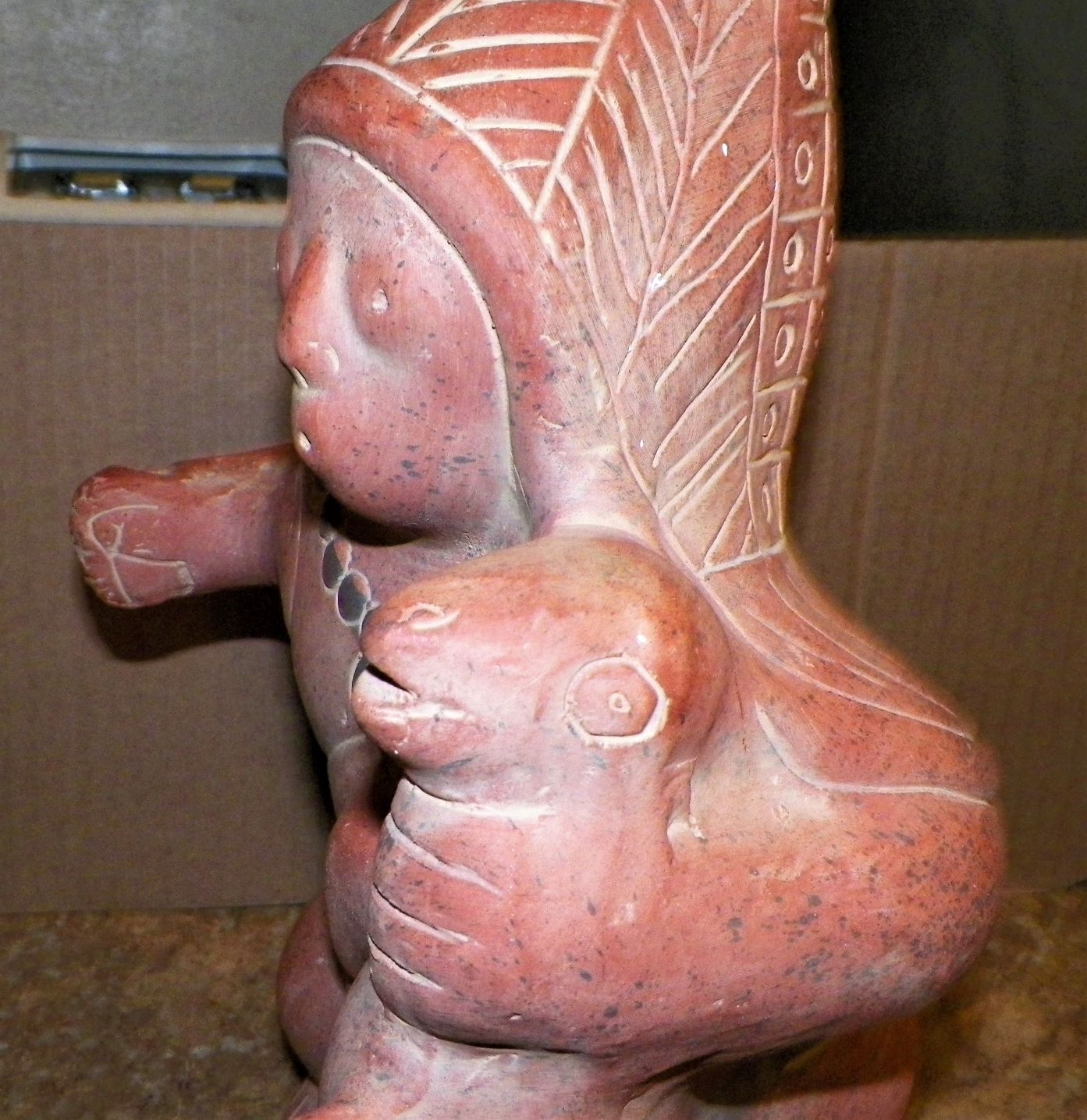 ART SCULPTURE MEXICAN FIGURE HOLDING SEAL BODY 2AAA.JPG