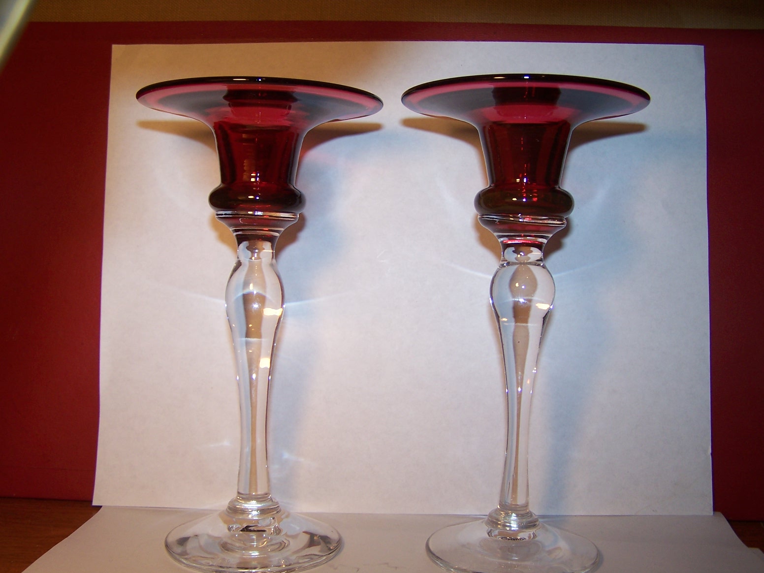 Bristol Cranberry glass candle holders. Antiques Board
