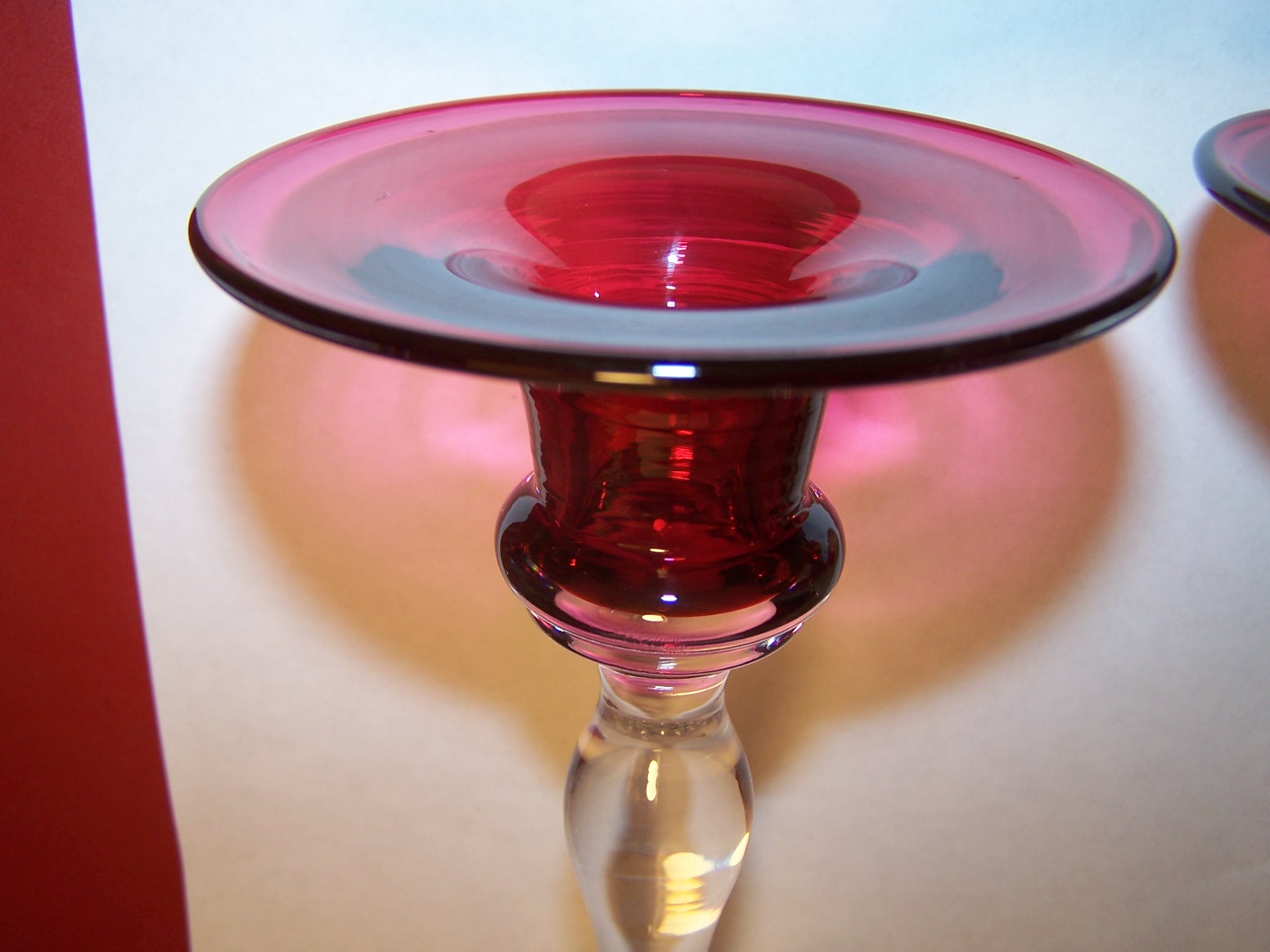 Bristol Cranberry glass candle holders. Antiques Board