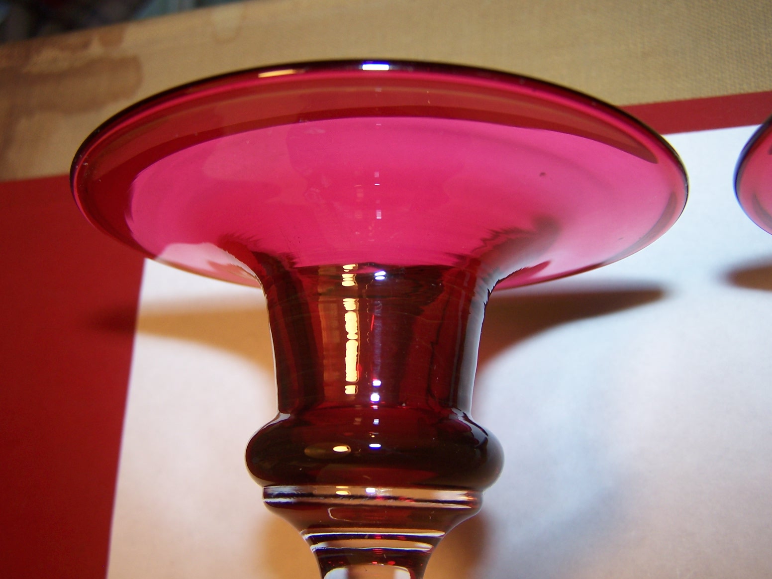 Bristol Cranberry glass candle holders. Antiques Board