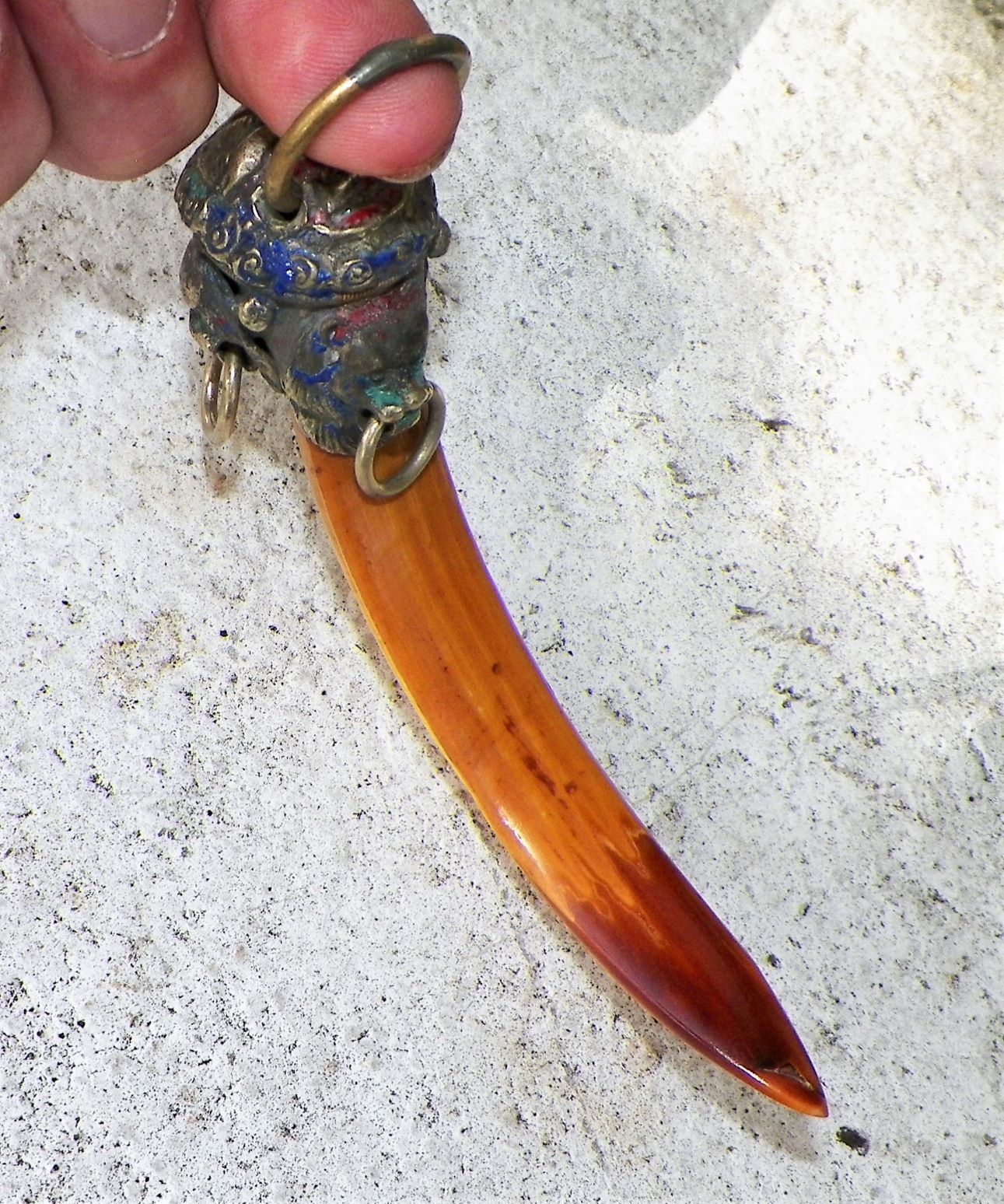 Any info on Boar's tooth(?) key ring w/thai(?) lion head cap ...