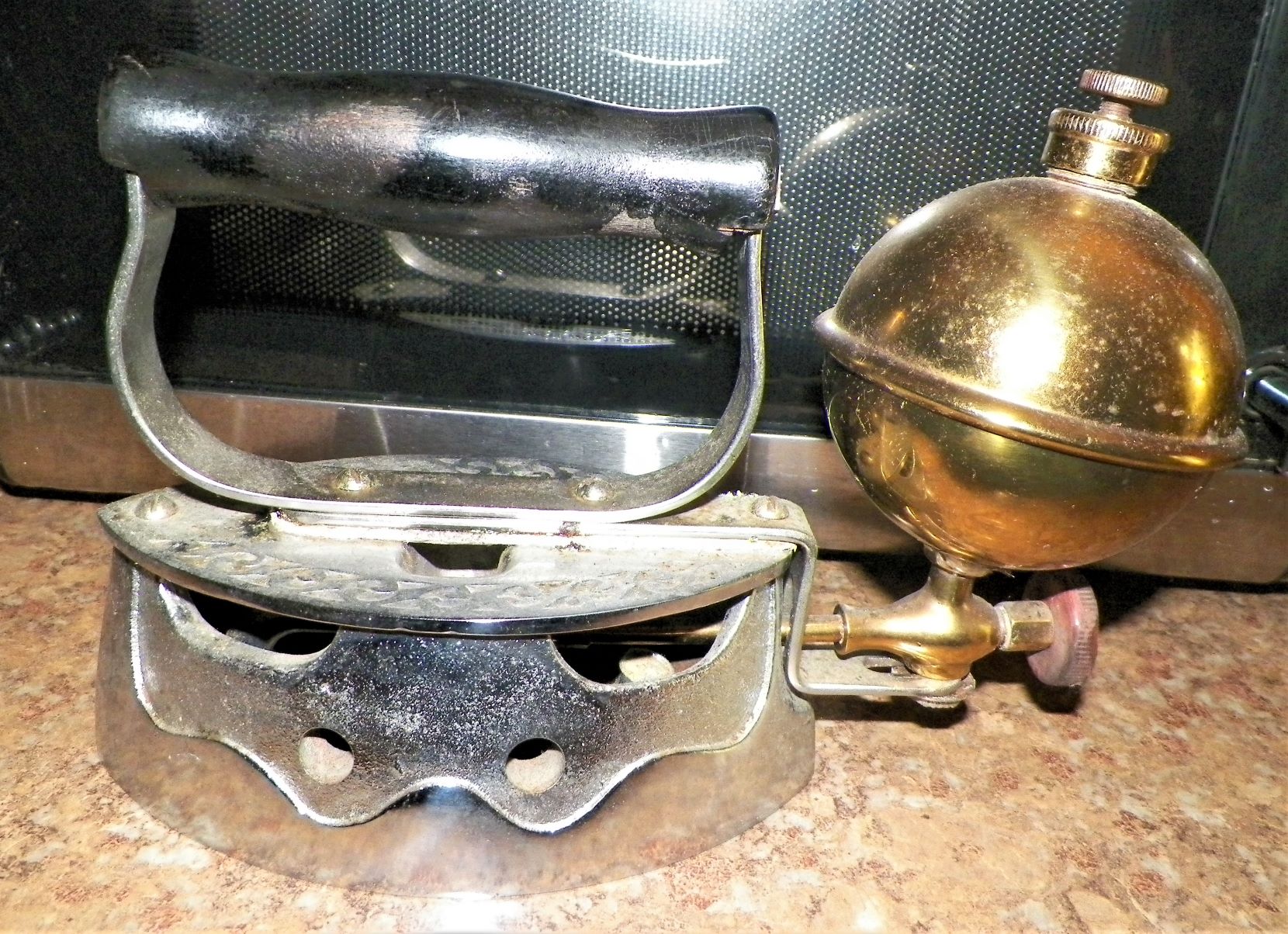 WHAT'S THE STORY ON COOL ANTIQUE GAS POWERED IRON? Antiques Board