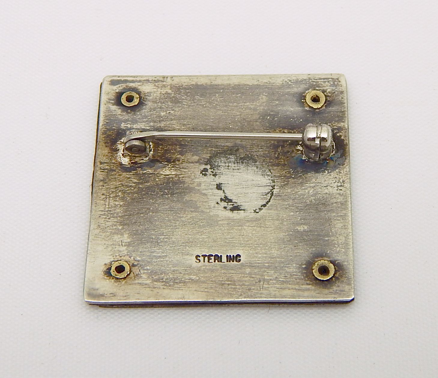 Odd sterling iron layered cross pin Antiques Board