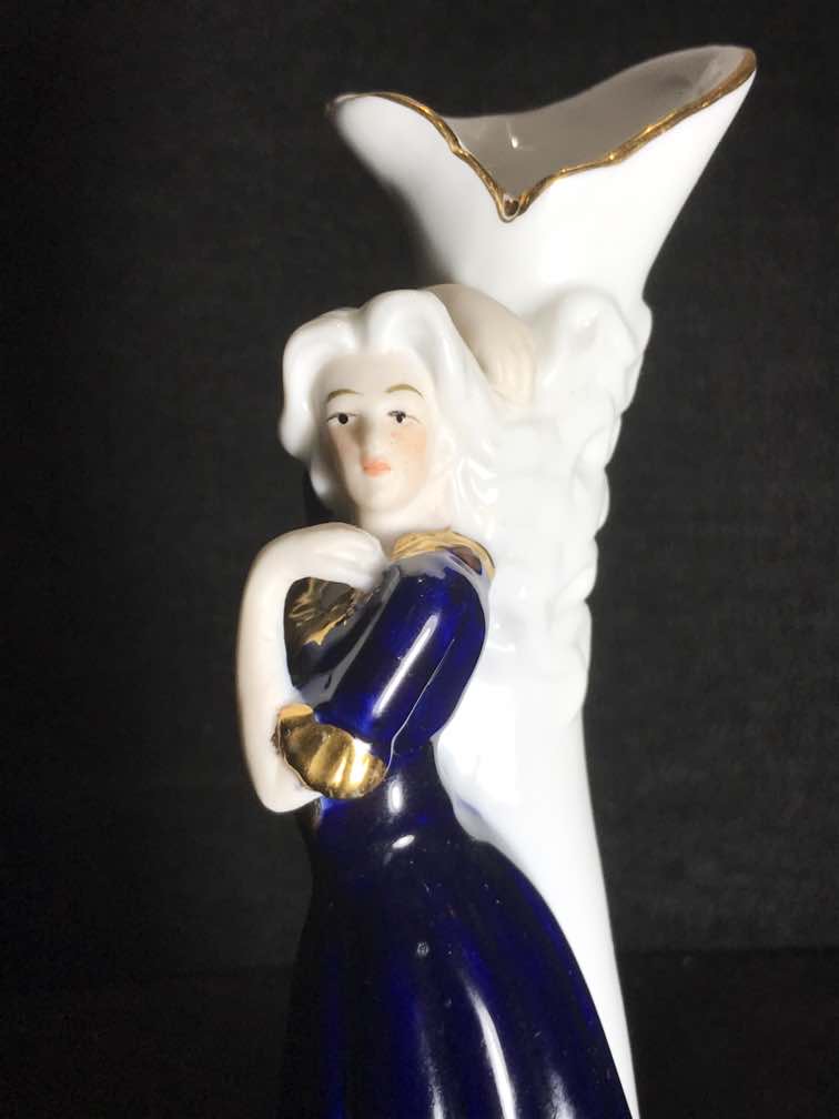 Please help identify Ceramic or porcelain figurine vase Antiques Board