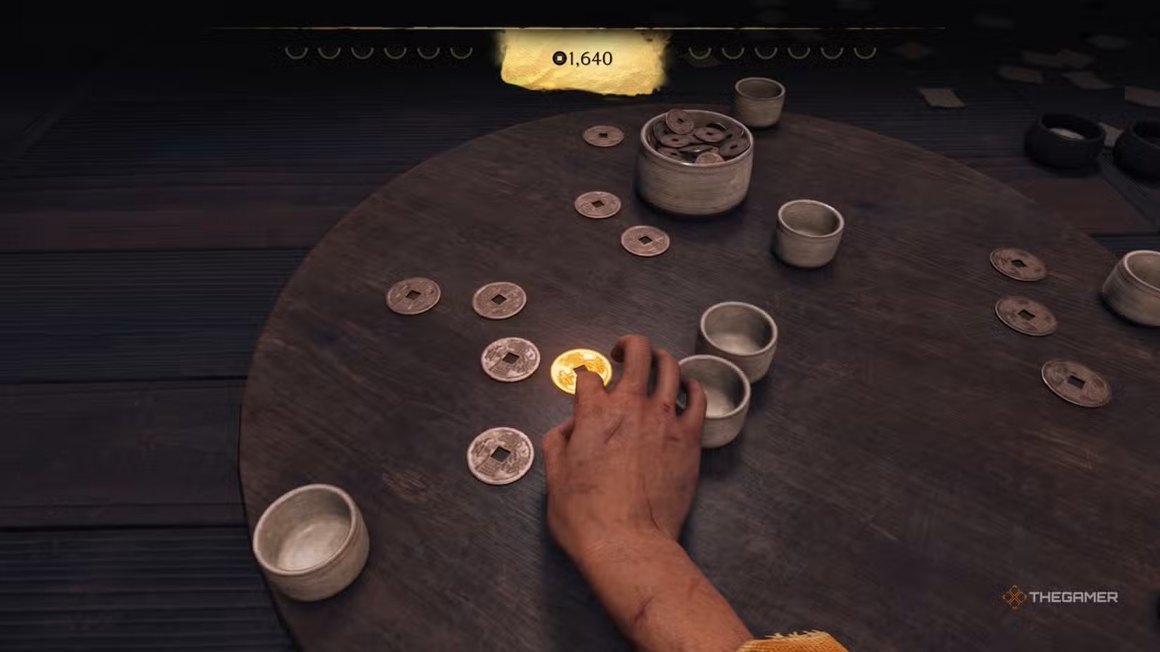 ghost-of-yotei-atsu-playing-zeni-hajiki-with-coins-across-a-table.jpg