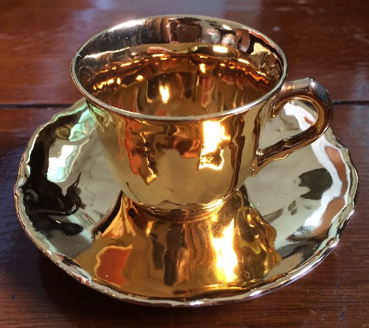 gold gilded teacup and saucer.jpg
