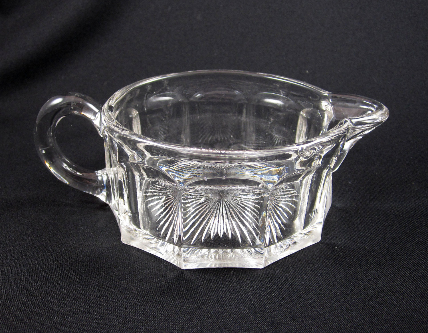 Is this clear glass stacking hotel creamer Heisey or Westmoreland