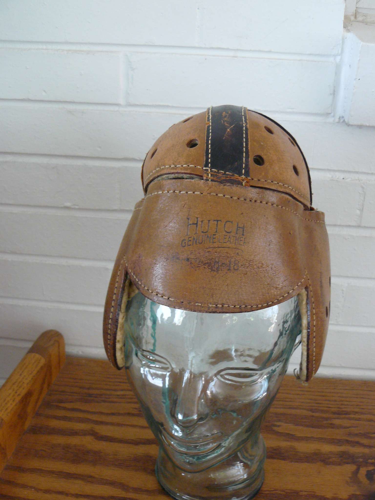 Antique leather Hutch 18 football helmet. Air holes throughout, is this