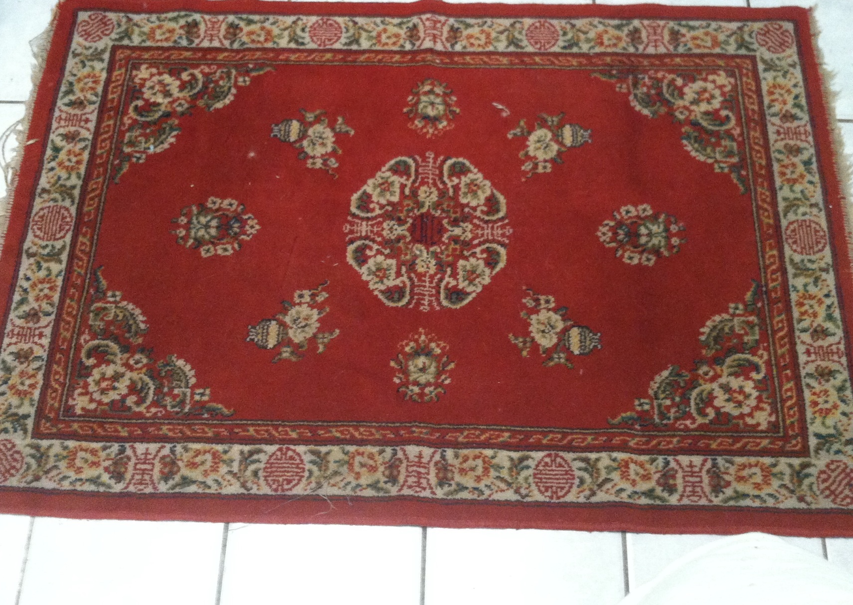 A carpet with tag on back, Kashmir Special German Rug... Antiques Board