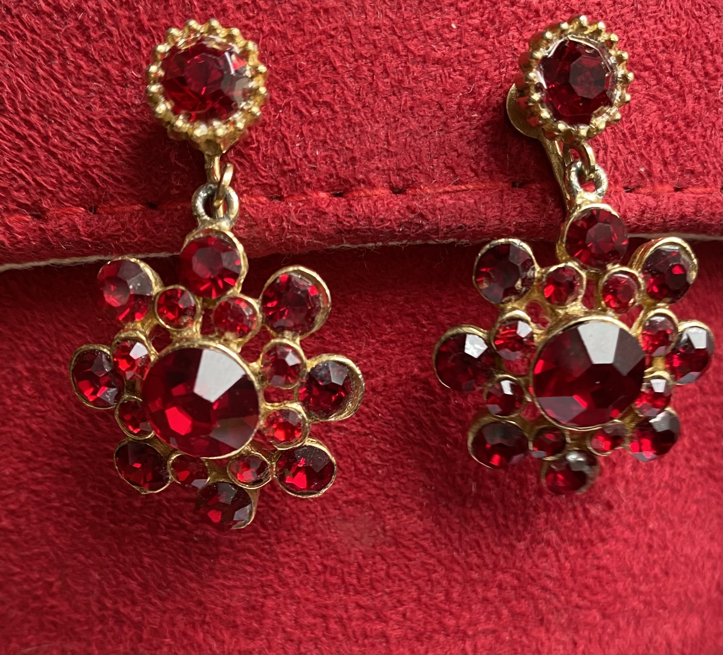Costume Jewelry red earrings name of stone? Any idea if they are worth
