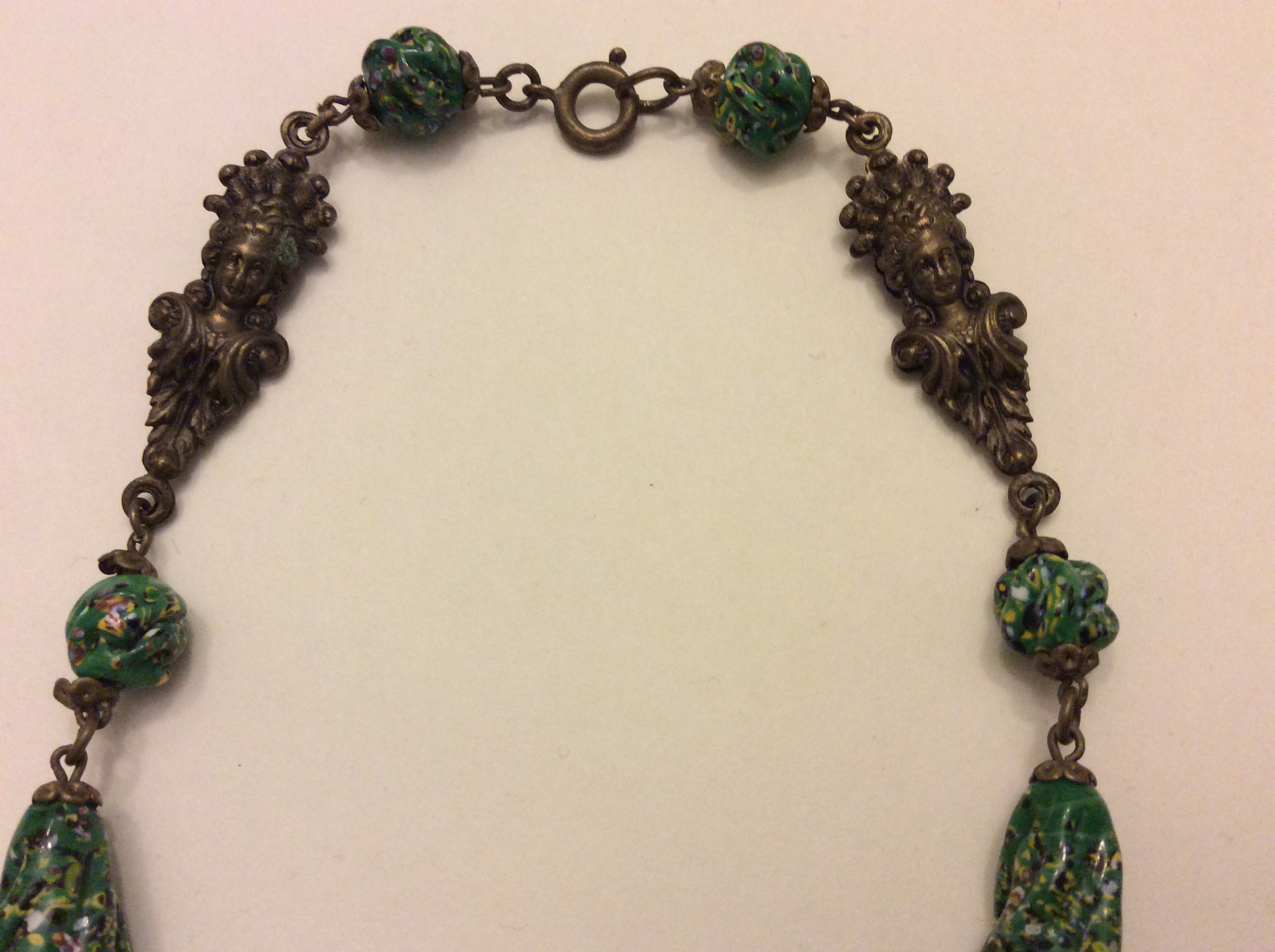 Necklace green clasp figural beads.JPG