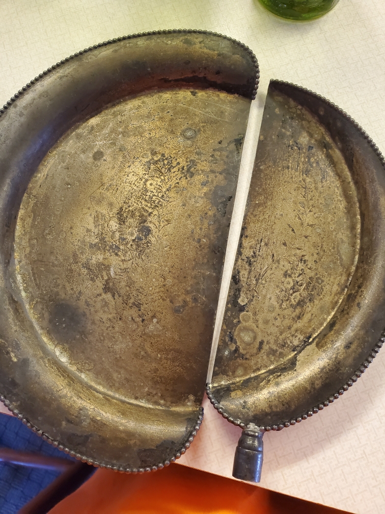 Looking for help identifying this piece of brass Antiques Board