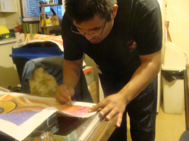 winston night signing his paintings.JPG