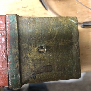 Bronze cap on bottom of legs