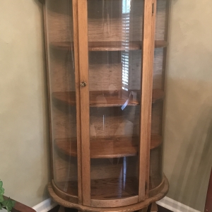 Curved glass china cabinet with key