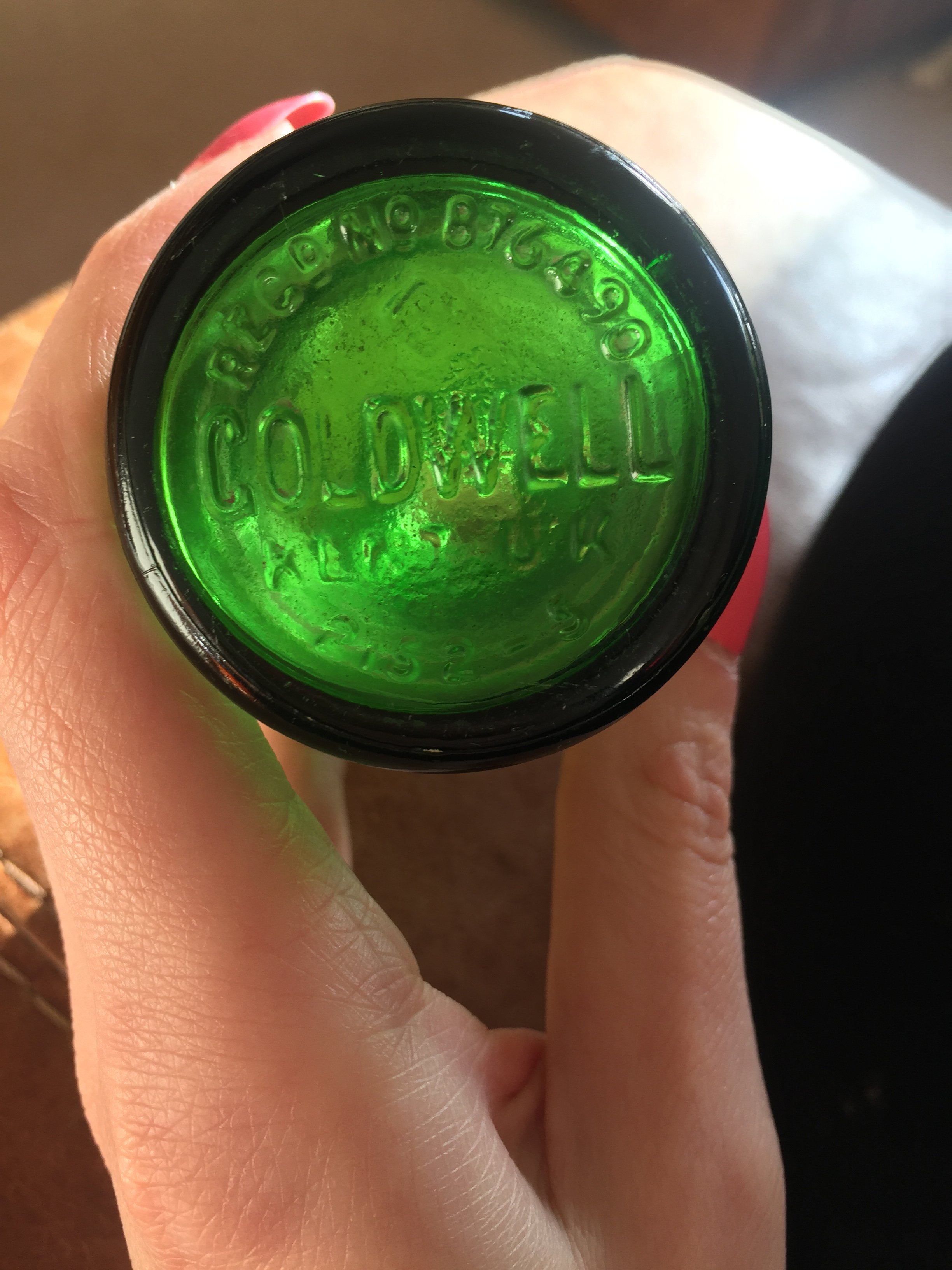 Base of COLDWELL GLASS BOTTLE