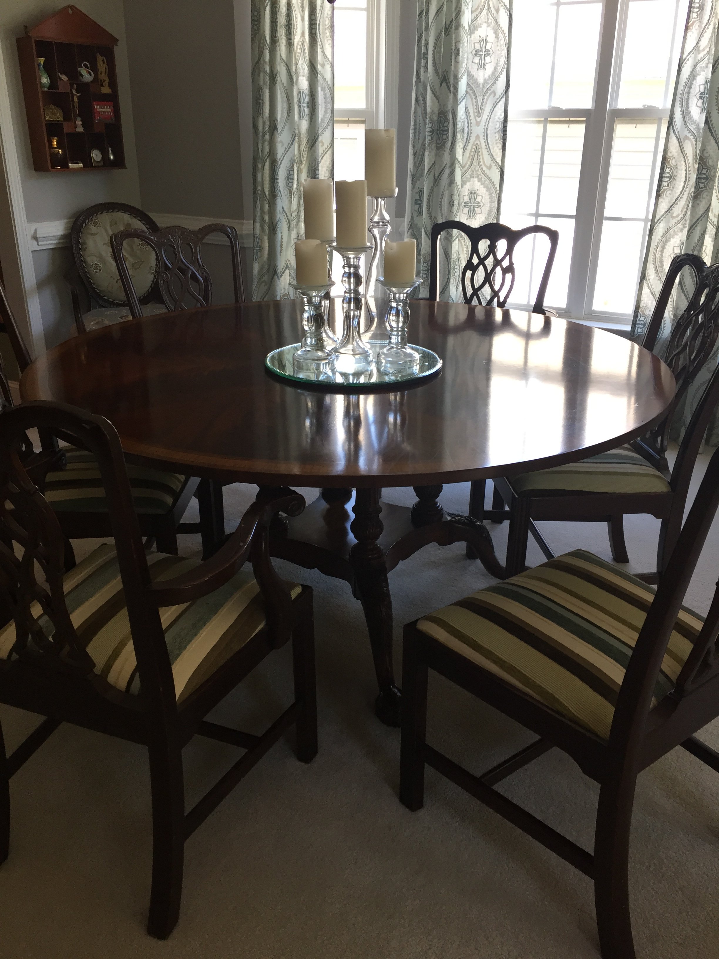 Pedestal mahogany table and Chippendale chairs