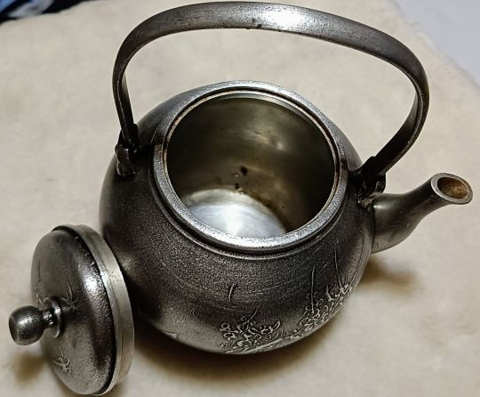 silver teapot inside